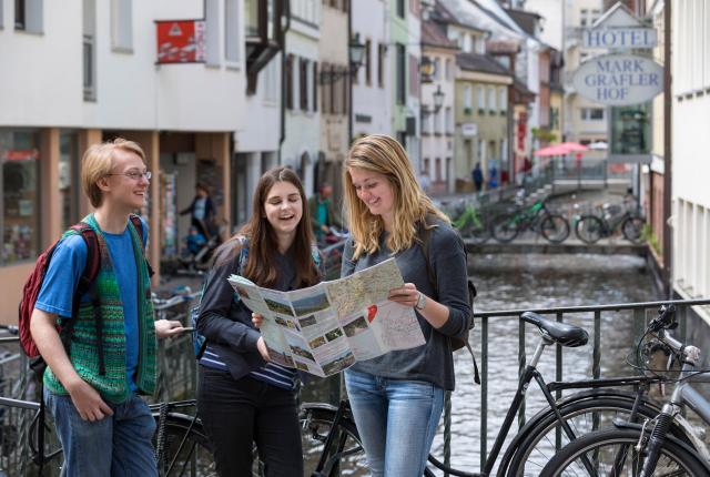 students looking at a map in Freiburg