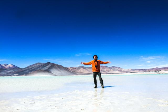a student poses for a fun photo on the salt flats in San Pedro de Atacama, Chile