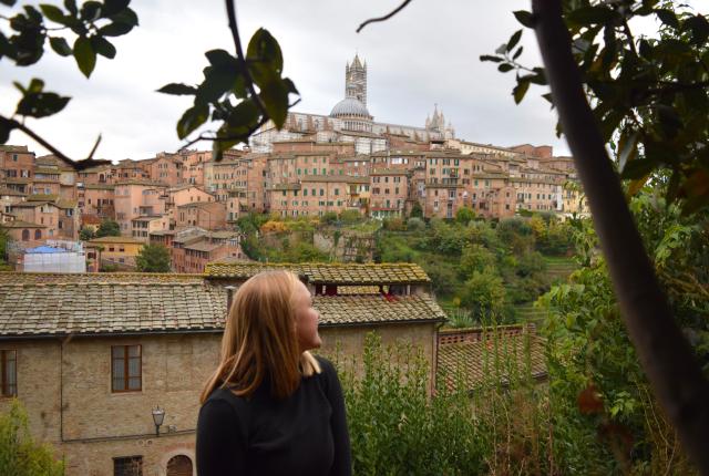a student looking over their shoulder at Siena