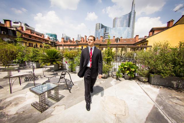 a business student walking in Milan