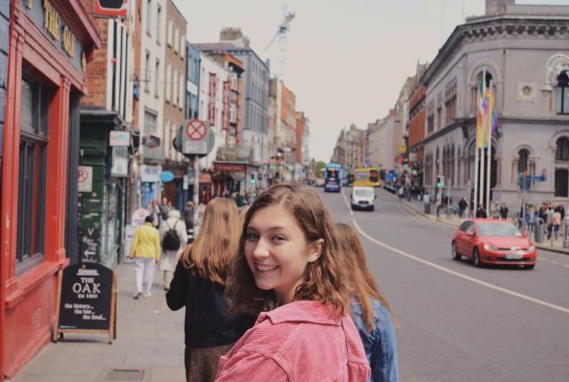 a student in Temple Bar turning around for a fun photo
