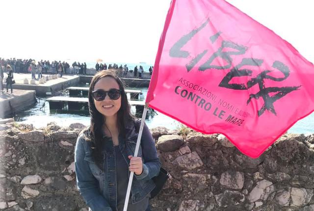 Student holds a Libera flag