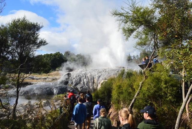 students walking through a geothermal area in Rotorua