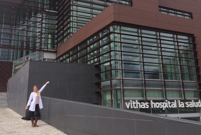a Granada student intern standing outside of a hospital for her internship placement