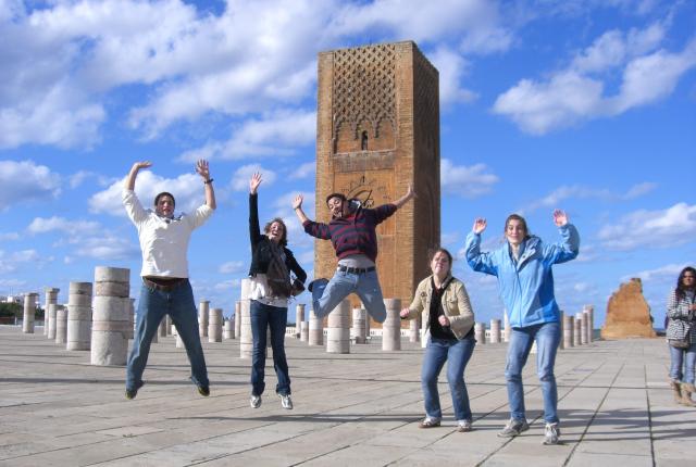 Students jumping outside of Hassan tower in Rabat, Morroco