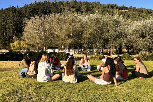 Students in Cape Town sitting in circle outside