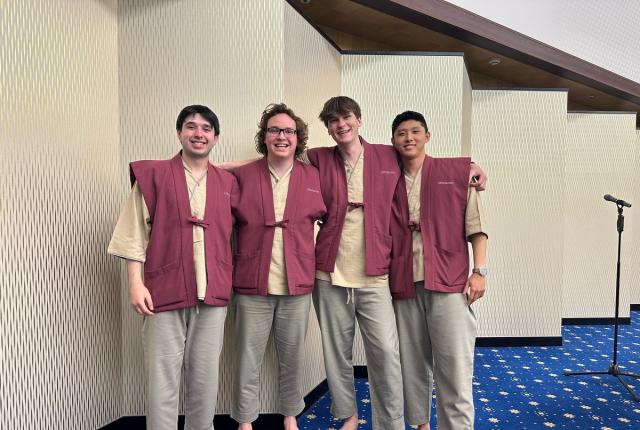 Students smiling on a field trip in Tokyo