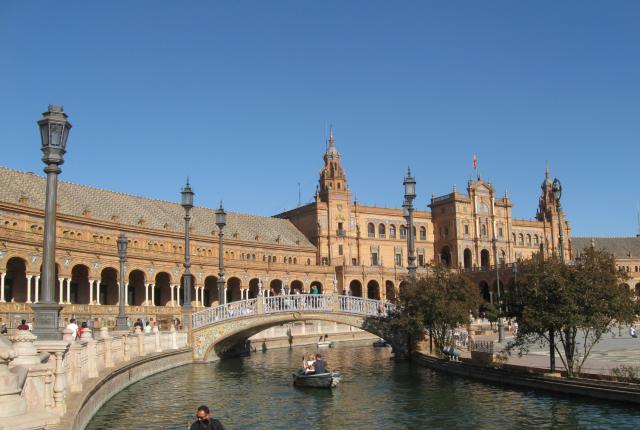The river in Salamanca filled with rowboats.