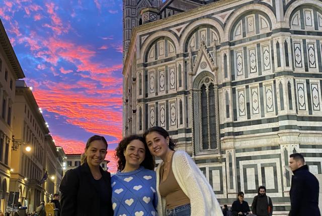 Friends at sunset in Florence, Italy in front of the Duomo