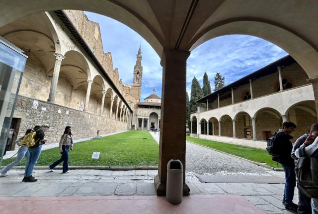 Courtyard in Florence with students walking through it