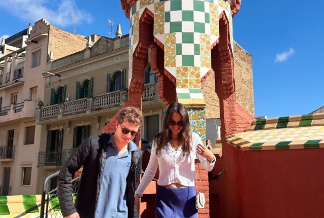 Friends on a sunny rooftop enjoying the unique architecture of Casa Vicens in Barcelona