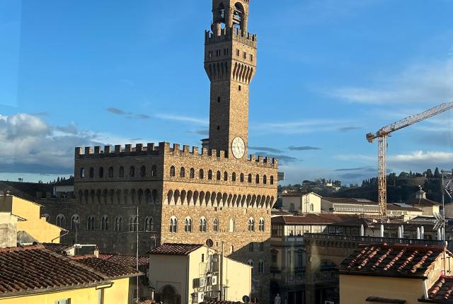 Ariel view of architecture in Florence, Italy against a blue skye