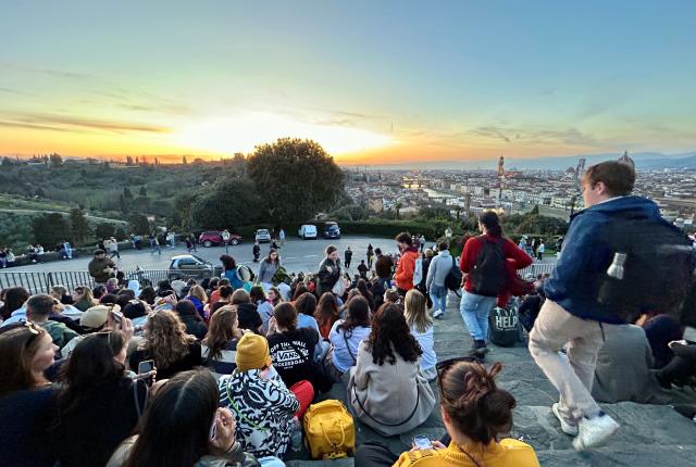 Group of students watching sunset in Florence, Italy