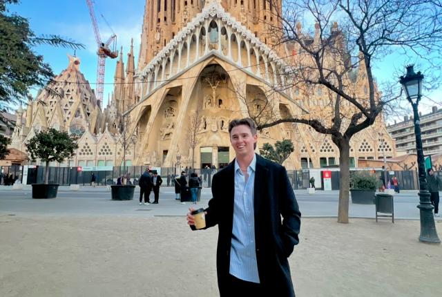 IES Abroad Barcelona intern on his way to work past La Sagrada Familia
