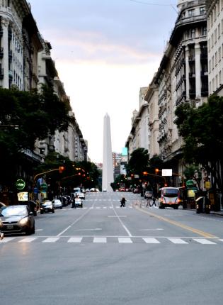 the obelisco sculpture in the center of a street in Buenos Aires