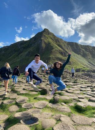 students jump for a fun photo in Ireland