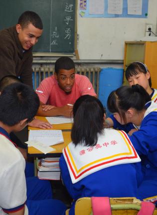student teacher teaching students in a classroom in Shanghai