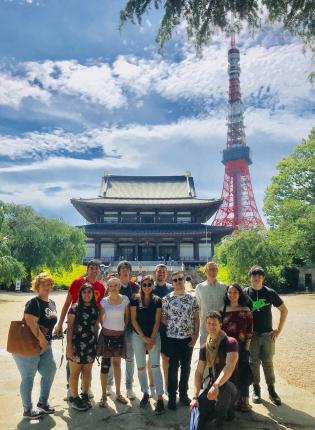 Students standing in front of a palace and Tokyo Tower