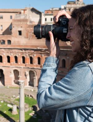 a student takes a photo of the Roman Forum in Rome