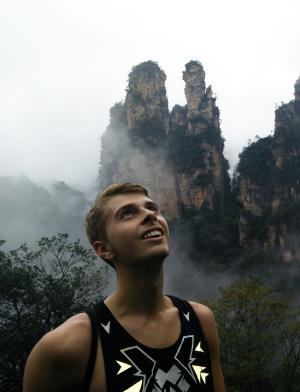 a student looking up at the mountains at Zhangjiajie National Forest Park