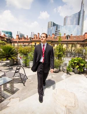 a business student walking in Milan