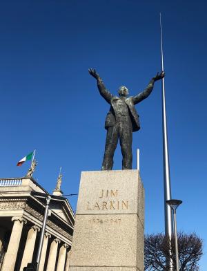 a Jim Larkin statue and the Spire in Dublin