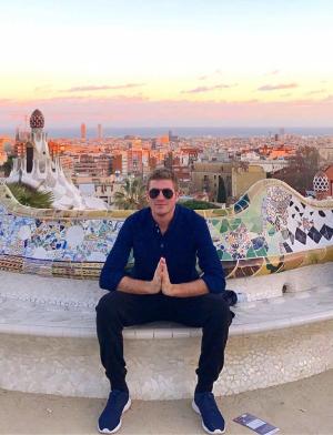 a male student poses for a photo at Park Güell