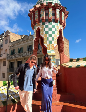 Friends on a sunny rooftop enjoying the unique architecture of Casa Vicens in Barcelona