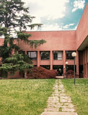 The exterior of a multi-level brick building.
