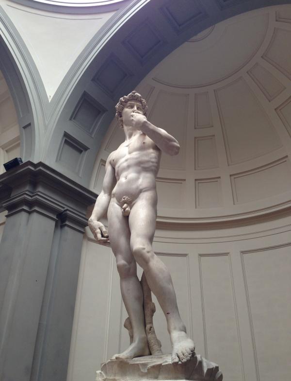David sculpture by Michelangelo. A marble statue of a nude man. 