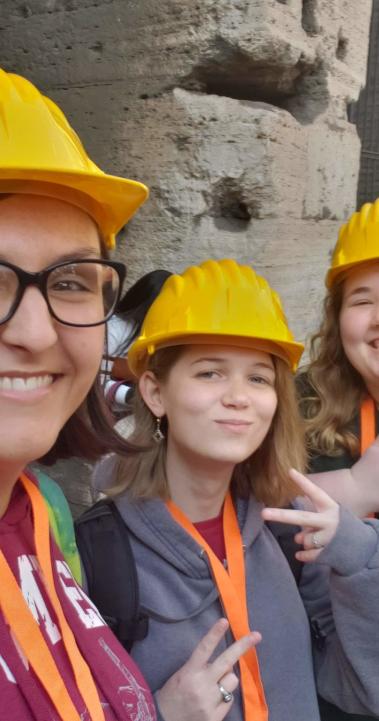student interns pose for a photo while working at an archeological site in Rome