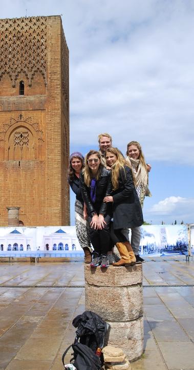 students standing on a pose in front of Hassan Tower in Rabat