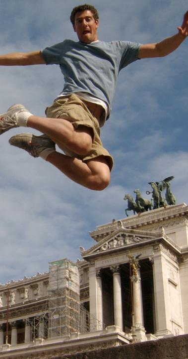 a student jumping for a fun photo at Altar of the Fatherland