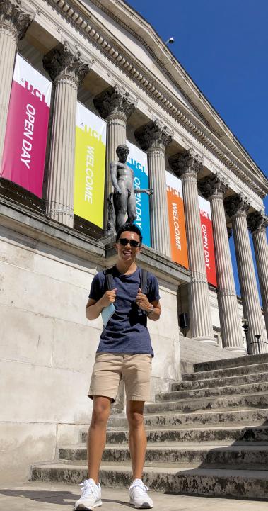 a student standing on the steps of University College London
