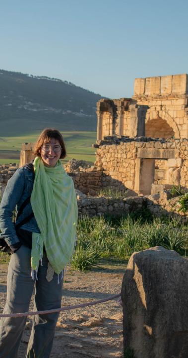 A student smiles at an archaeological site in Volubilis, Morocco.