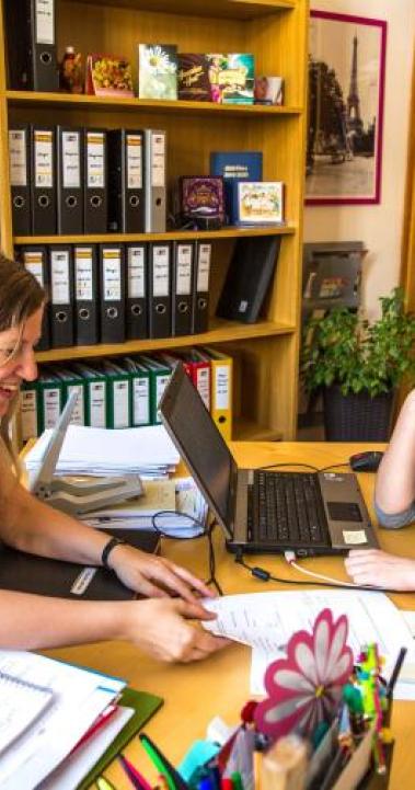Two women sitting at a table having a conversation