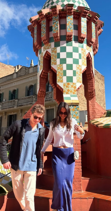 Friends on a sunny rooftop enjoying the unique architecture of Casa Vicens in Barcelona