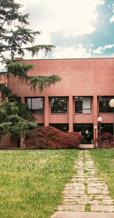 The exterior of a multi-level brick building.