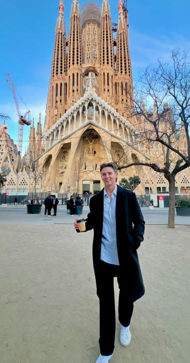IES Abroad Barcelona intern on his way to work past La Sagrada Familia