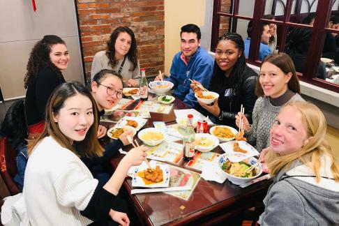 students eating Chinese food in Shanghai