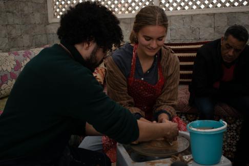 Students in Meknes making pottery.