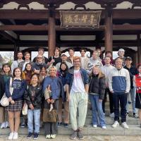 A group photo of IES Abroad students in Tokyo, Japan in front of a temple.
