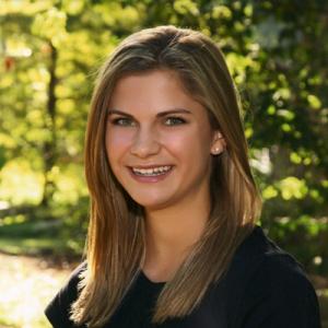 1. Aerial view of a sprawling city under a cloudy sky.
2. Sunset over Barcelona with vivid pink and purple hues.
3. Twilight cityscape with glowing city lights.
4. Portrait of a smiling woman with long hair in a green park. This alt text was added with Al; accuracy may vary.