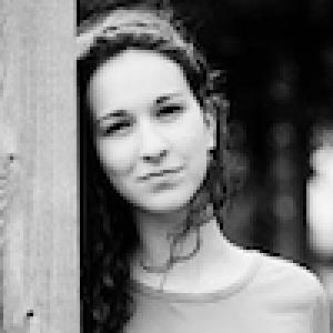 Smiling woman with straight hair; woman with curly hair; serious man in plaid shirt; woman by wooden post. This alt text was added with Al; accuracy may vary.