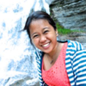 Faces of four smiling individuals. This alt text was added with Al; accuracy may vary.