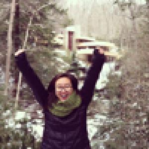Elegant dining room with ornate decor, blue walls, and a set dining table. This alt text was added with Al; accuracy may vary.