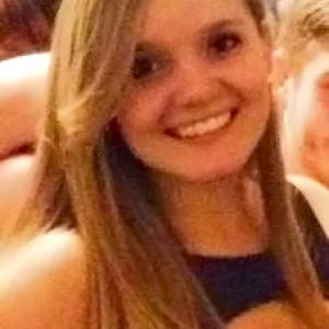 Smiling young man with a short haircut in a dark jacket. This alt text was added with Al; accuracy may vary.