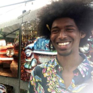 Ancient stone building tower with arched windows against blue sky. This alt text was added with Al; accuracy may vary.