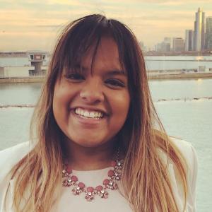 Dayna Mathew smiling at the camera