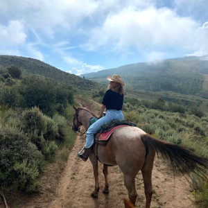 Headshot of Annabel Dwyer riding a horse